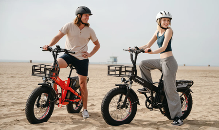 Two people riding their Mars 2 EBikes on the beach.