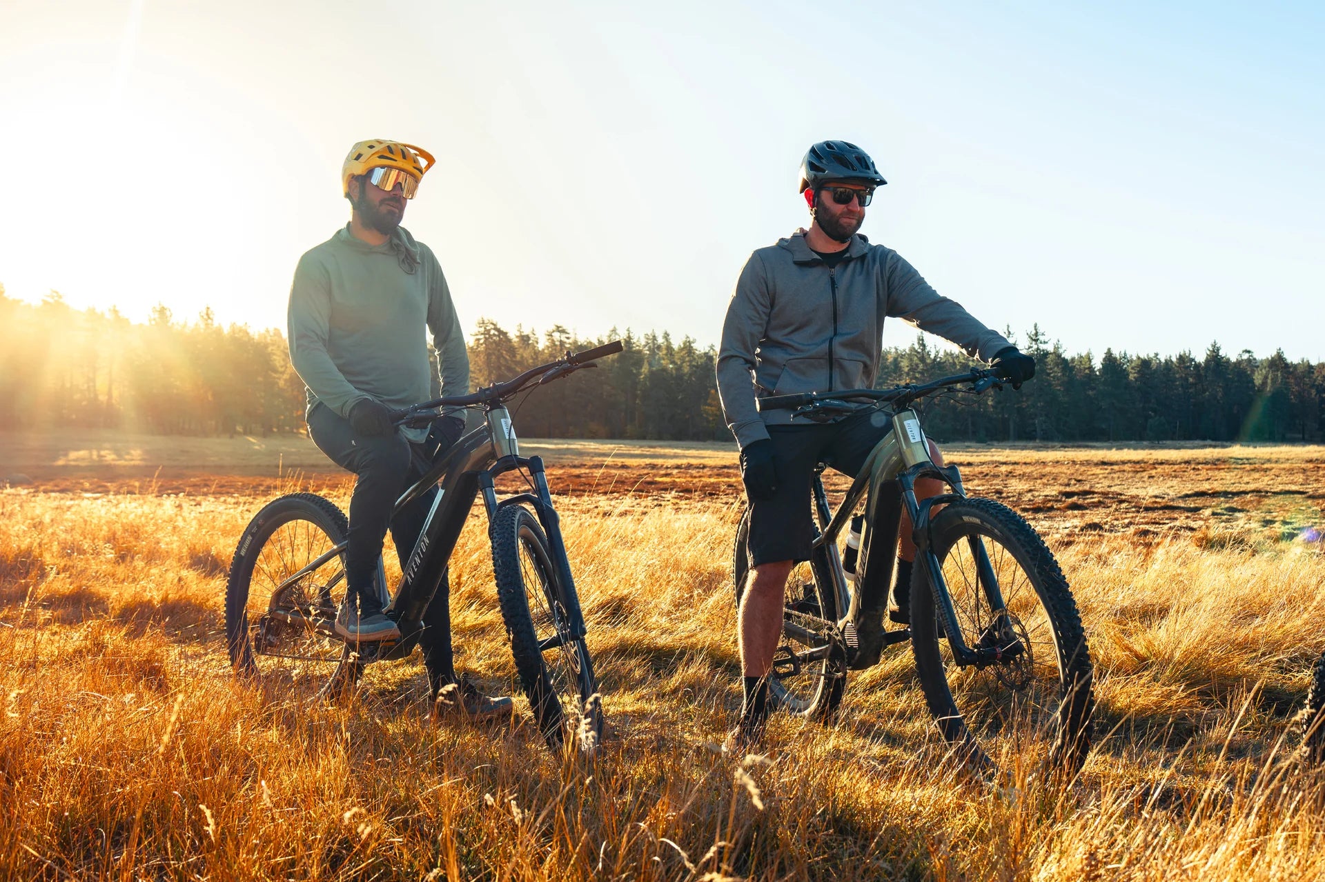 Two men riding their Aventon Ramblas Ebikes on a trail