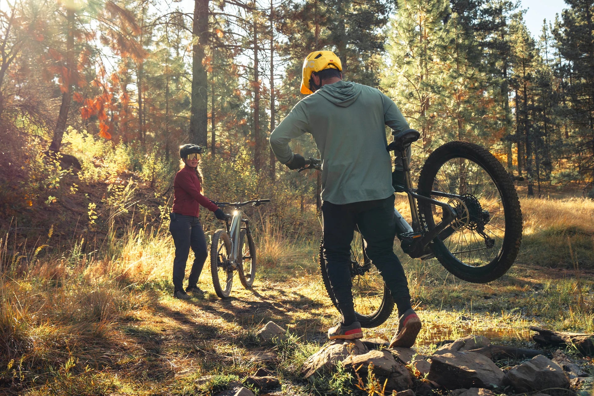 Two people with their Aventon Ramblas ebikes on a trail