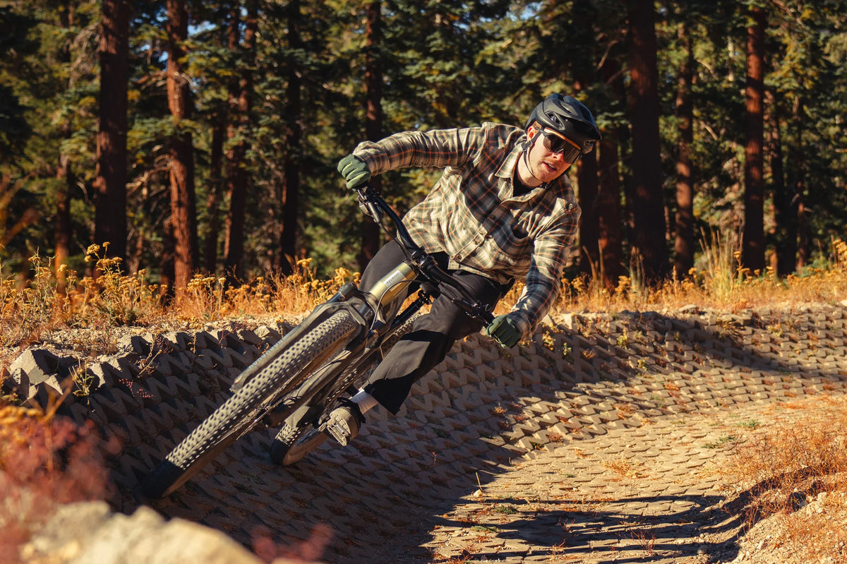 A man riding his Aventon Ramblas ebike on a trail
